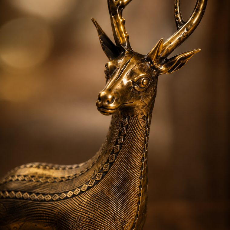 Lost-wax cast Dhokra brass sculpture with intricate tribal detailing