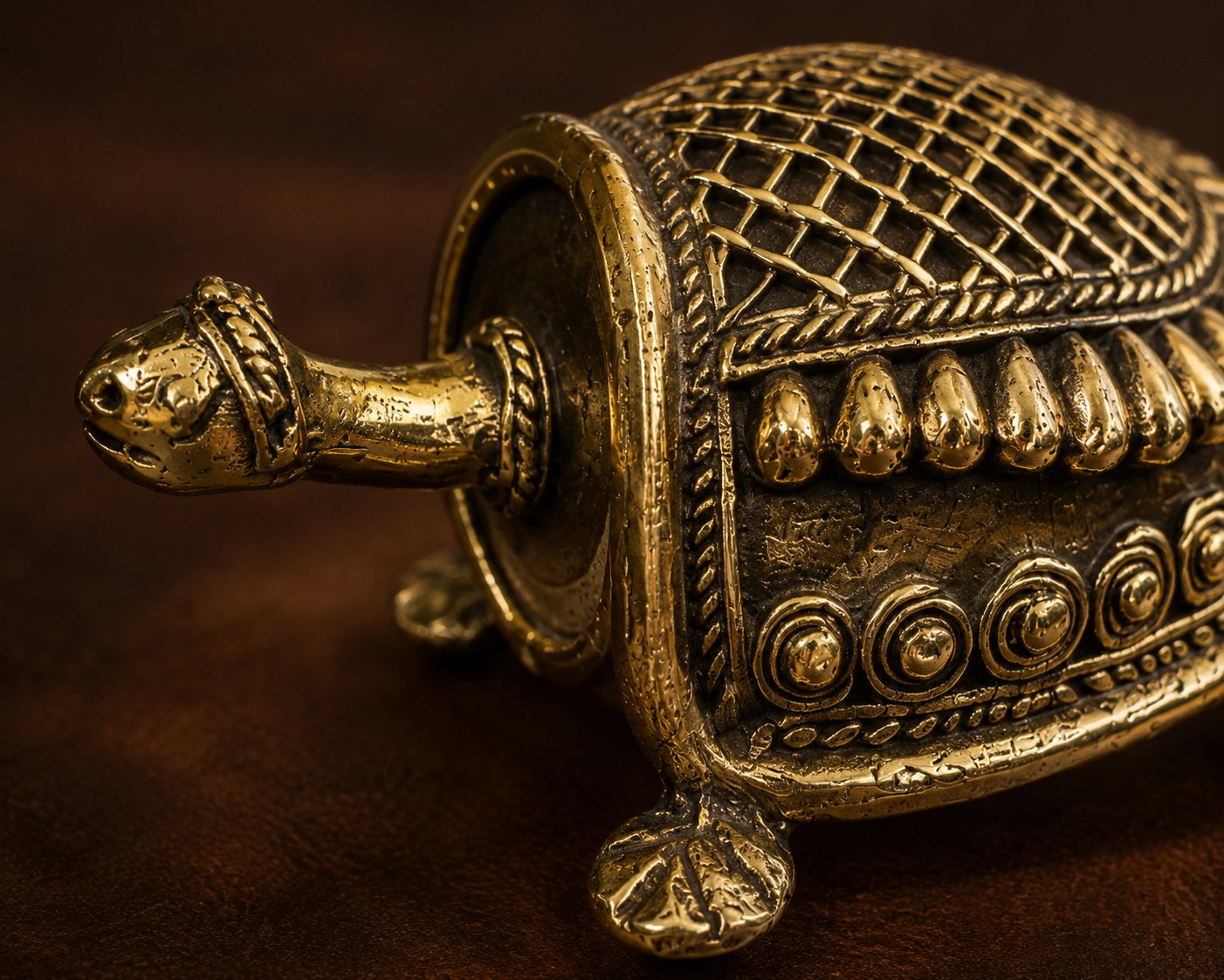 Detailed lost-wax cast texture on a Dhokra brass sculpture