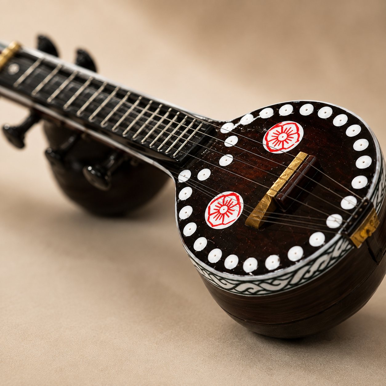 Close detail of hand-carved rosewood inlay work on a Bobbili Veena, showing fine handwork